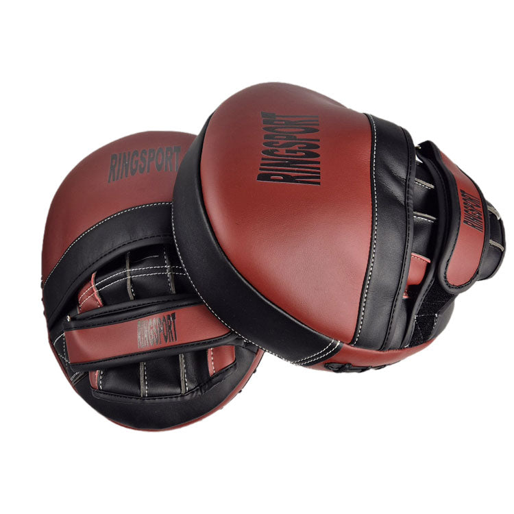 A pair of RINGSPORT focus pads, primarily red with black trim and hook-and-loop closures, designed for boxing training.