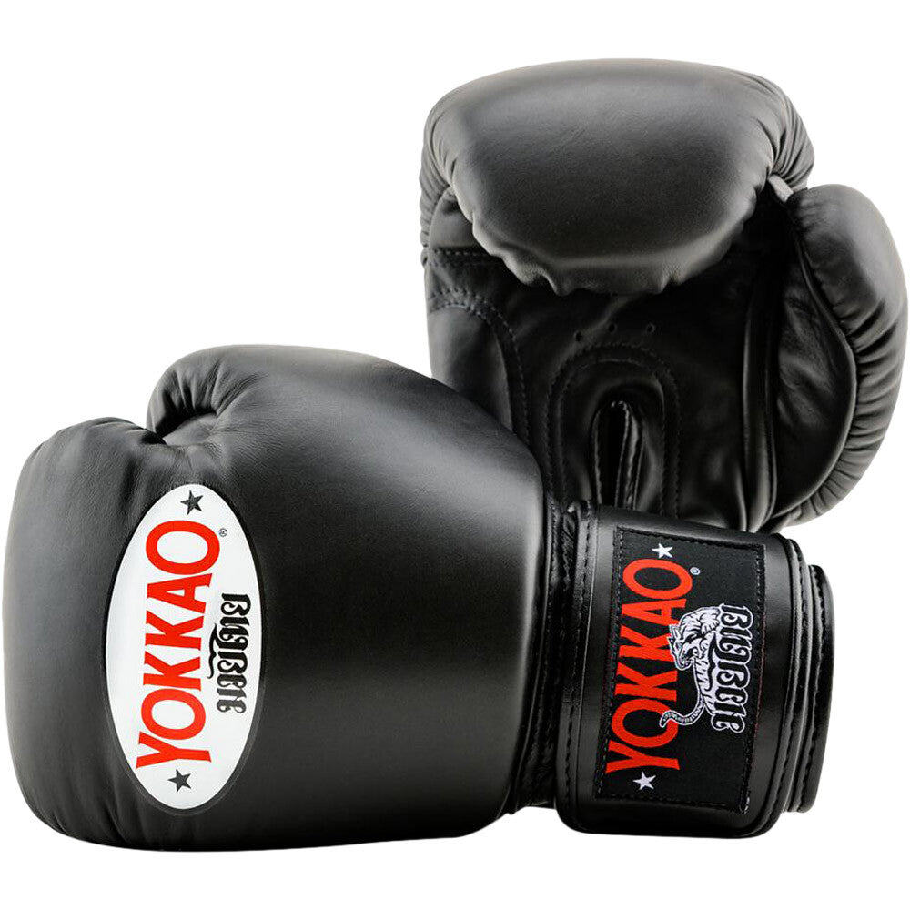 A pair of black Yokkao Muay Thai boxing gloves 