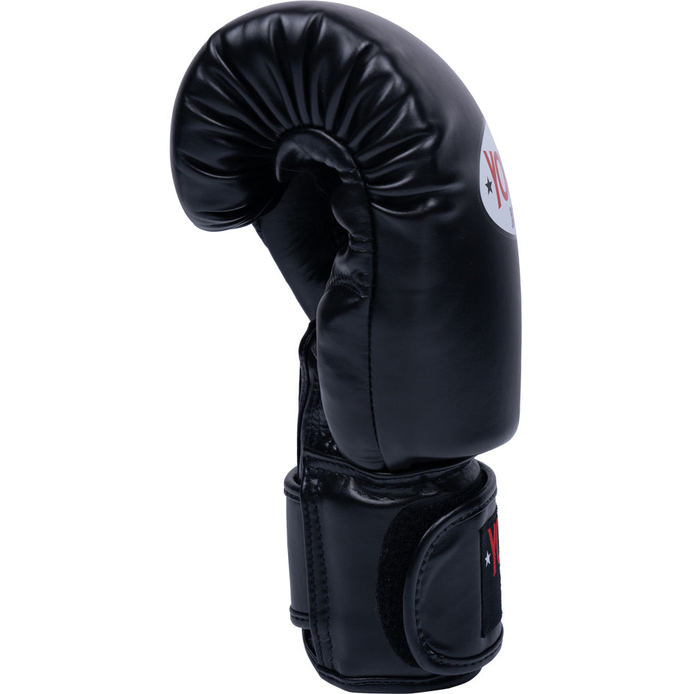A single black Yokkao leather boxing glove shown from the side 